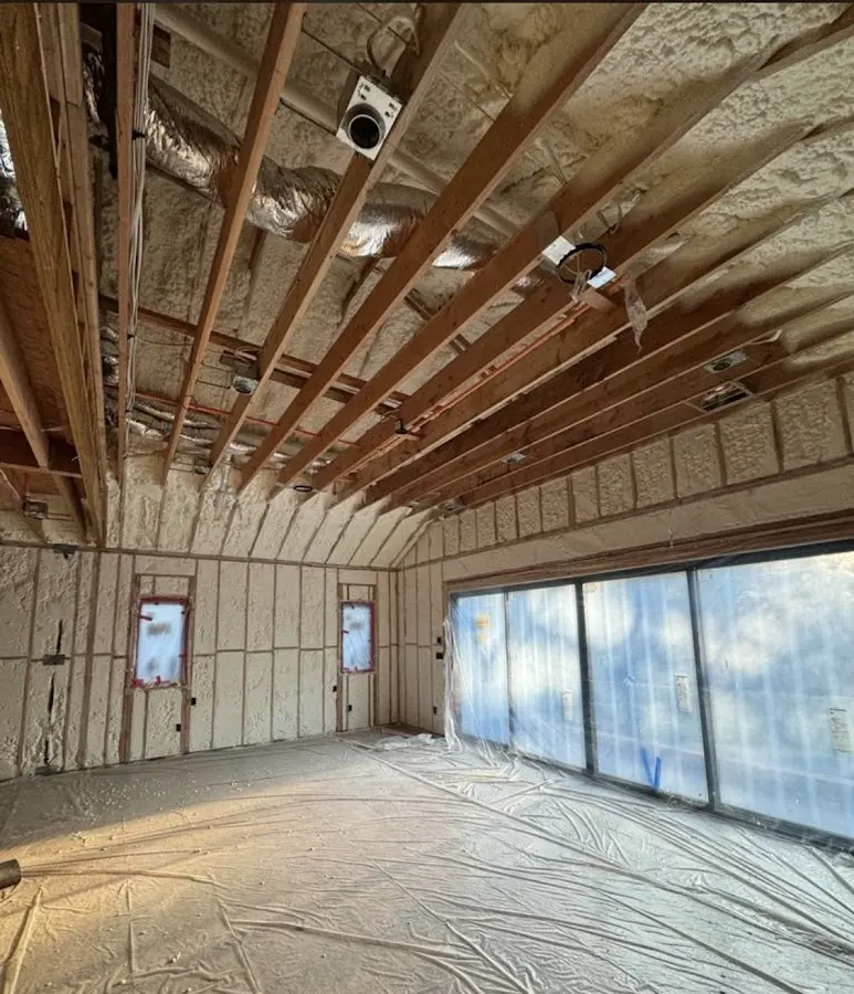Interior walls and ceiling insulated with spray foam during new construction in Orange City